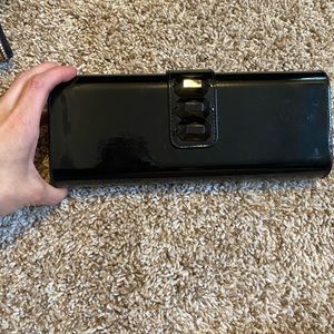 Black Lancôme clutch, magnetic closure